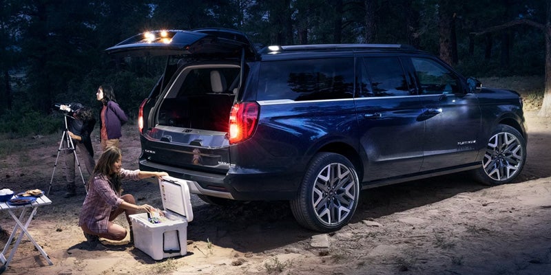 The 2026 Ford Expedition Tremor® is parked in a forest setting, highlighting its spaciousness and versatility for outdoor adventures.